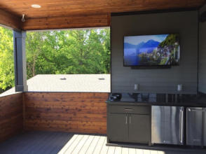 Wall mount of outdoor tv in the customers patio area.